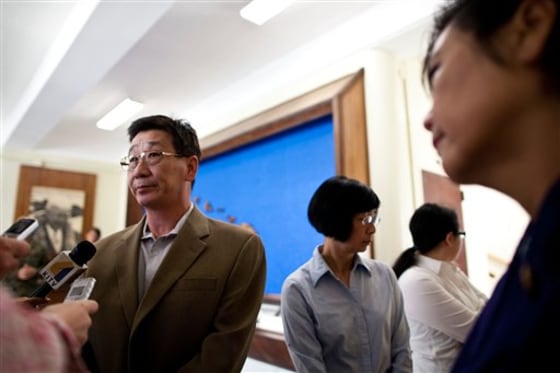 Allen Lew, father of Lance Cpl. Harry Lew, and Rep. Judy Chu of California, the dead Marine's aunt, spoke to the press Jan. 30 at Marine Corps Base Hawaii in Kaneohe Bay.